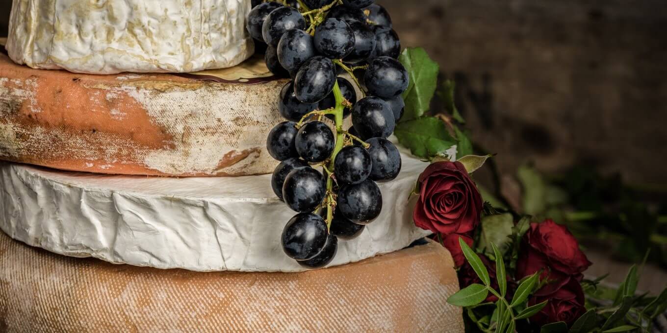 Cheese and grapes to represent cheese and wine